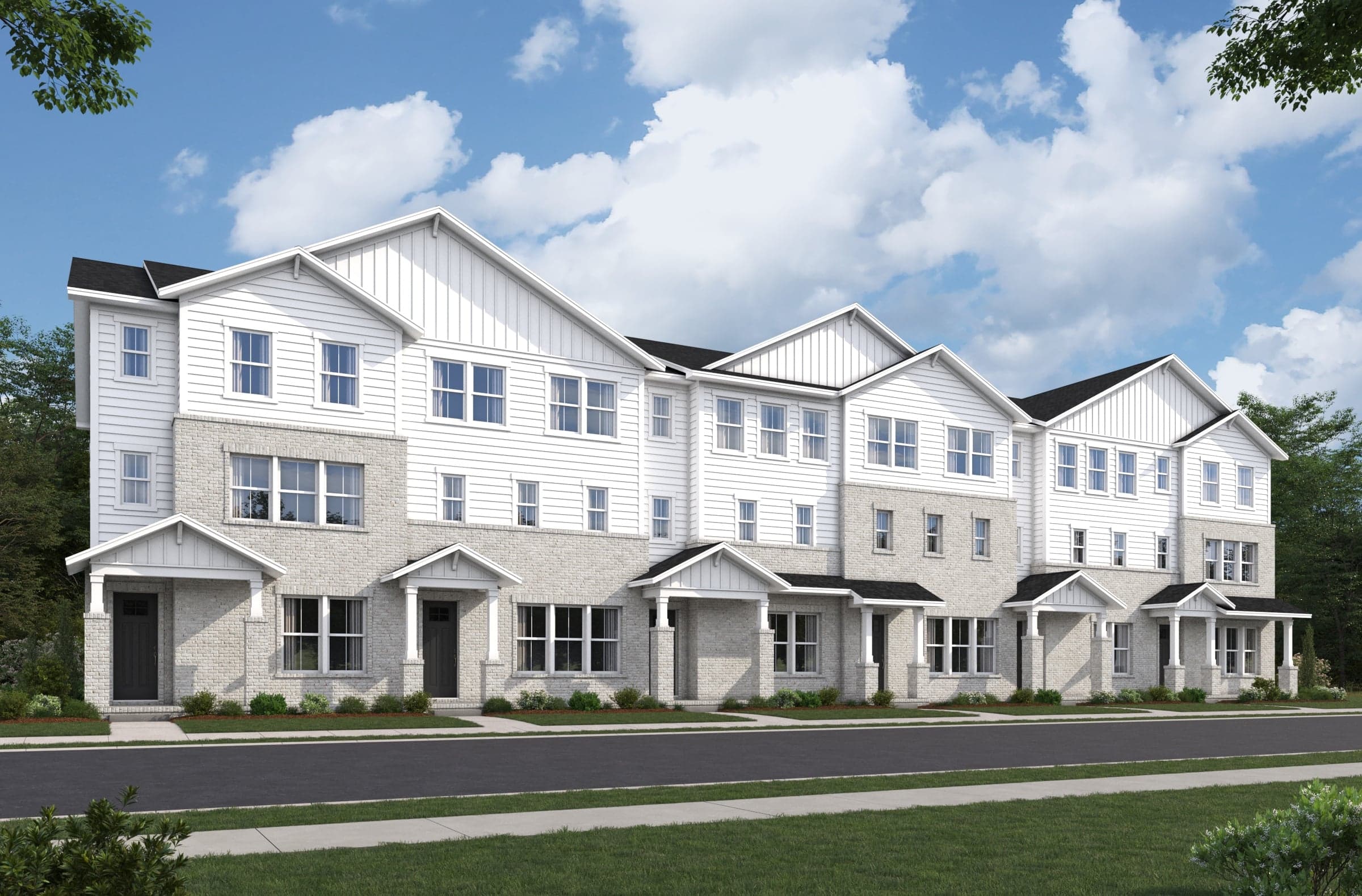 townhome exterior with brick and covered front porches