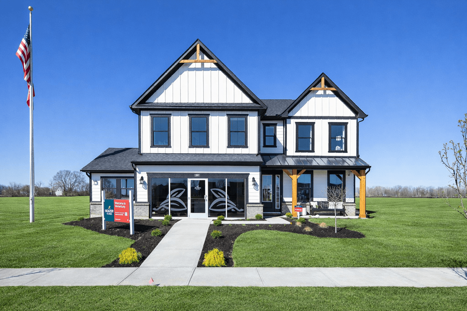 front exterior of home with white siding and a black roof