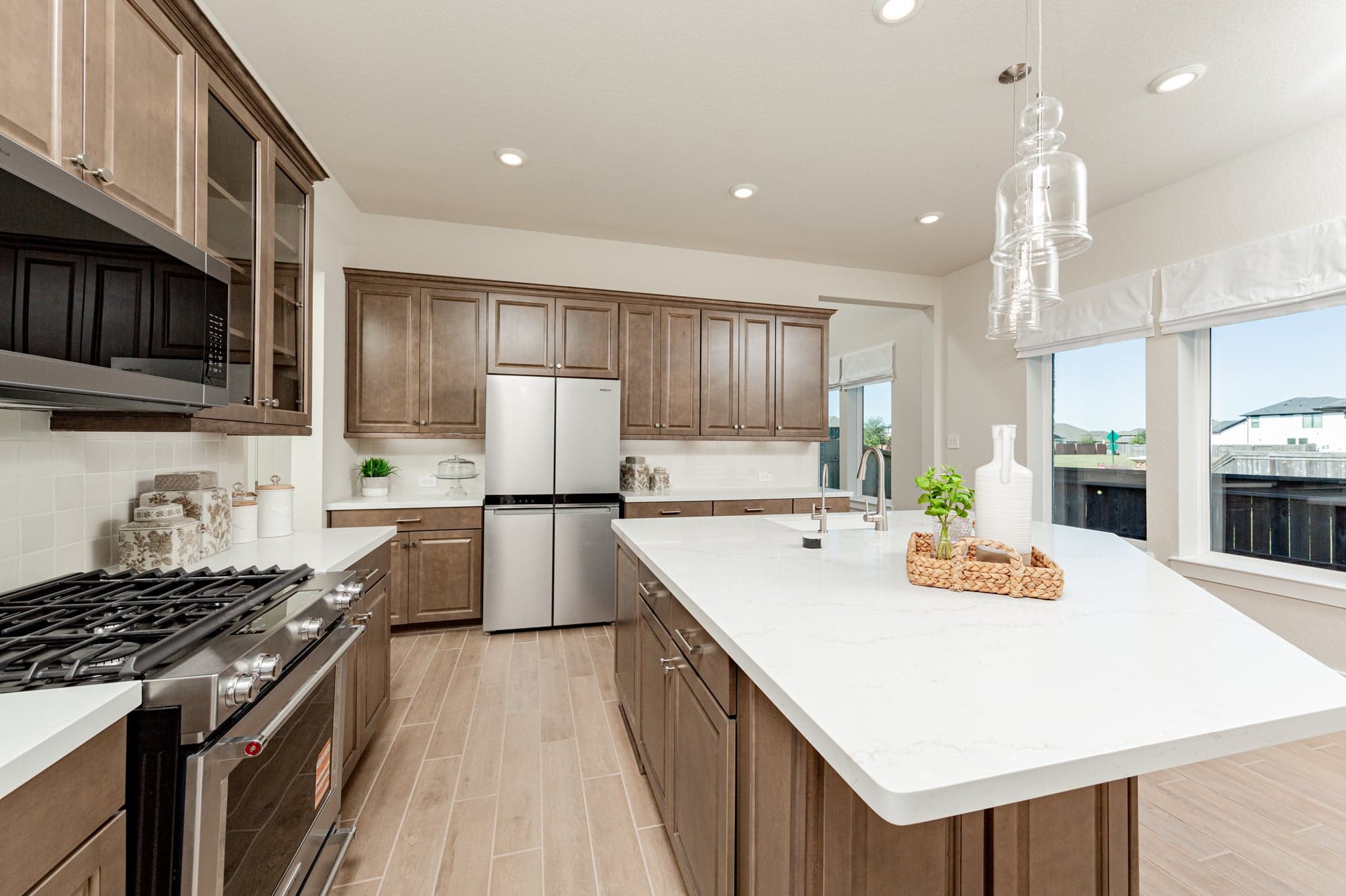 large kitchen with brown cabinets