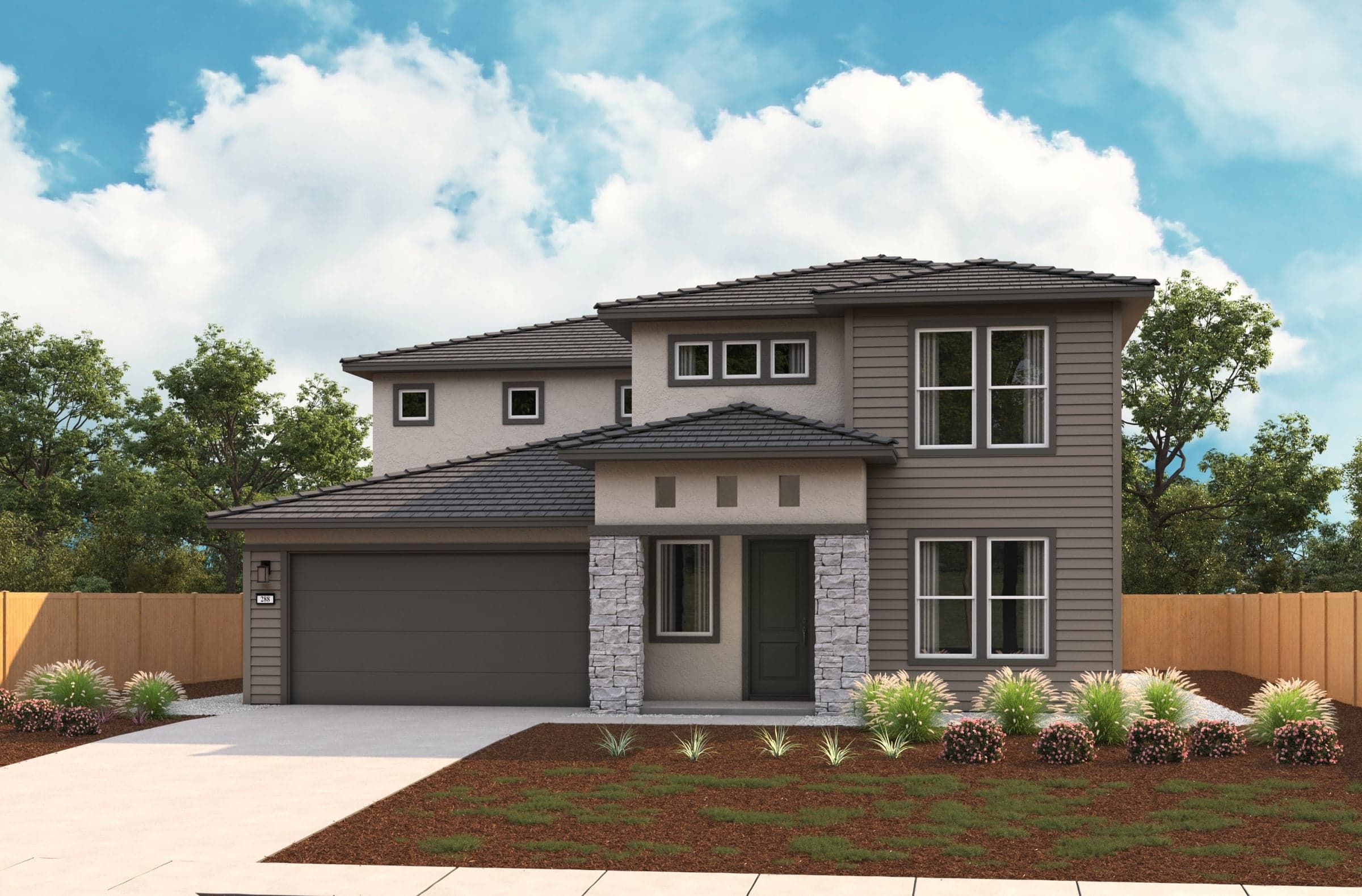 front exterior of two-story tan and gray home with stacked stone pillars