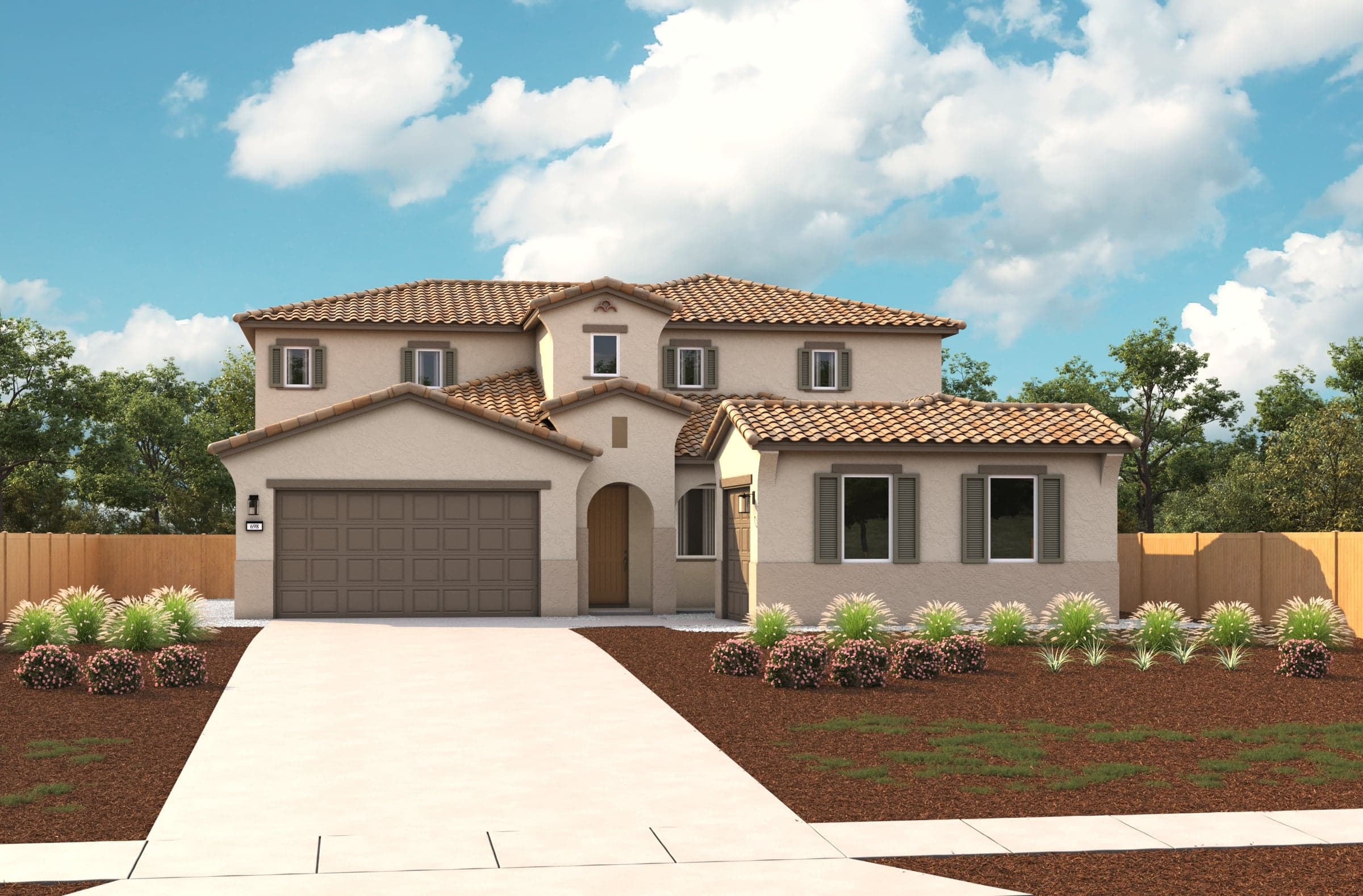 front exterior of two-story tan spanish style home with split 3-car garage and tile roof
