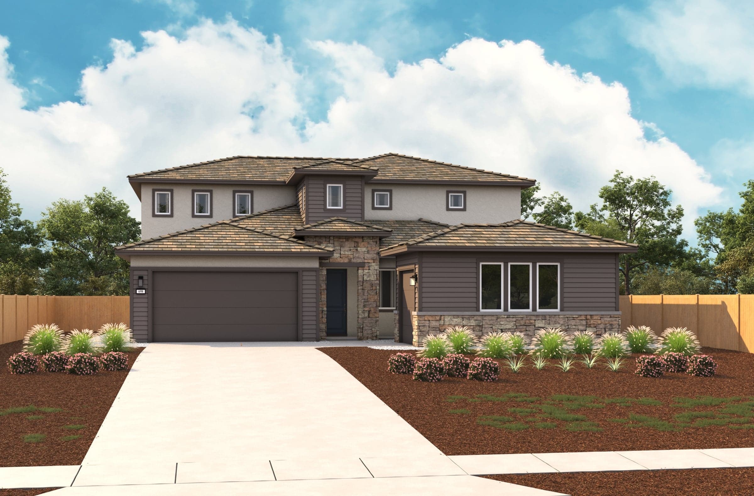 front exterior of two-story gray and tan home with multiple windows and stacked stone
