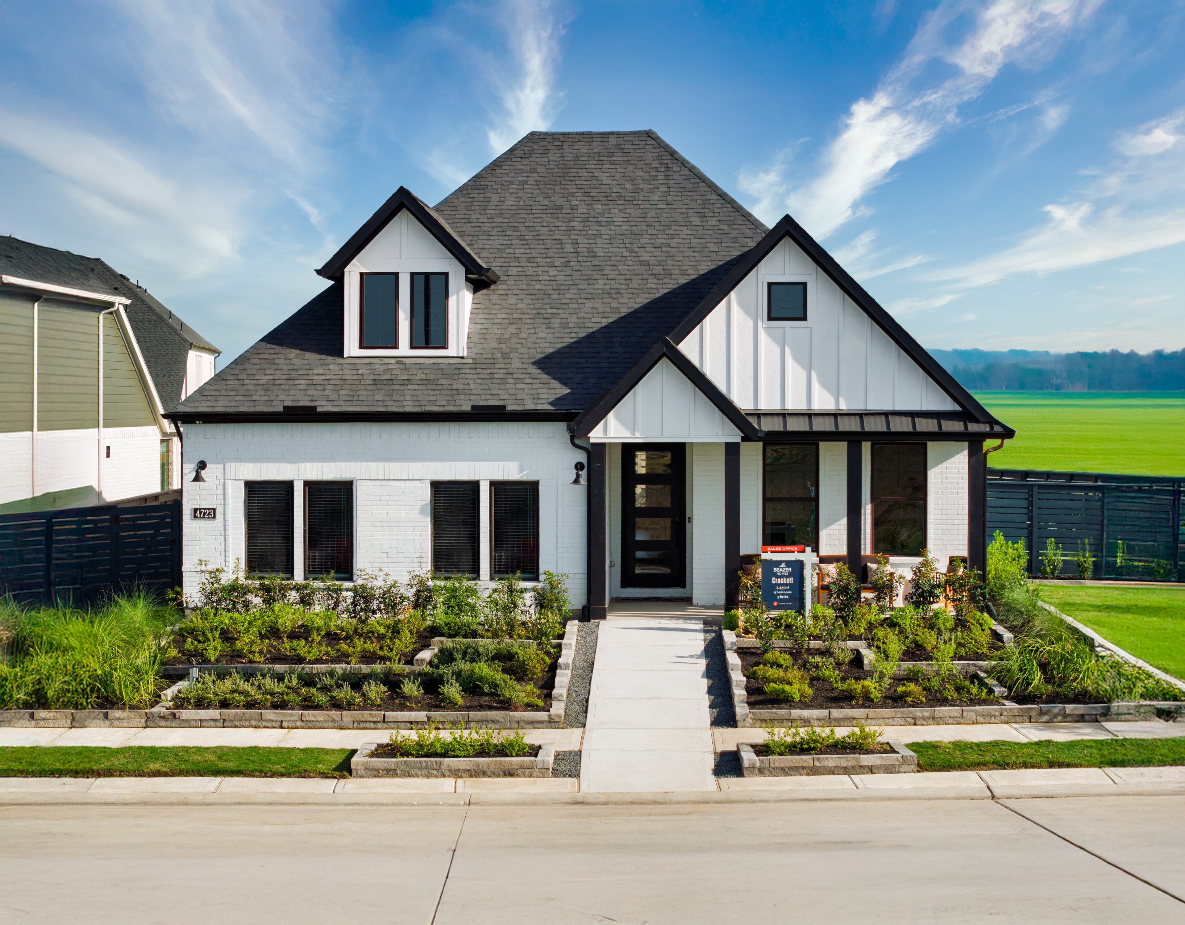 exterior of home with white brick and black siding