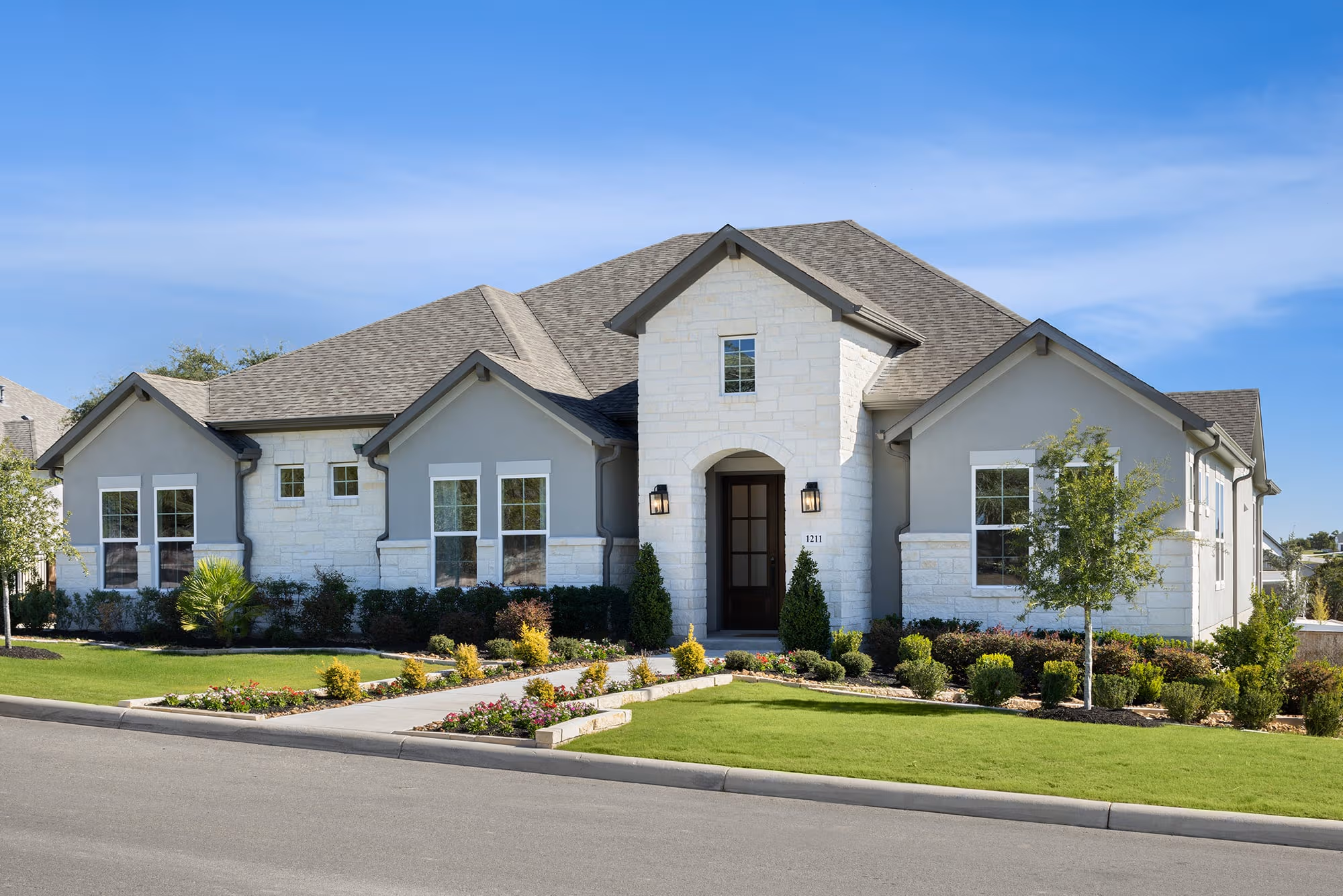 exterior with brick, stone & a walk way
