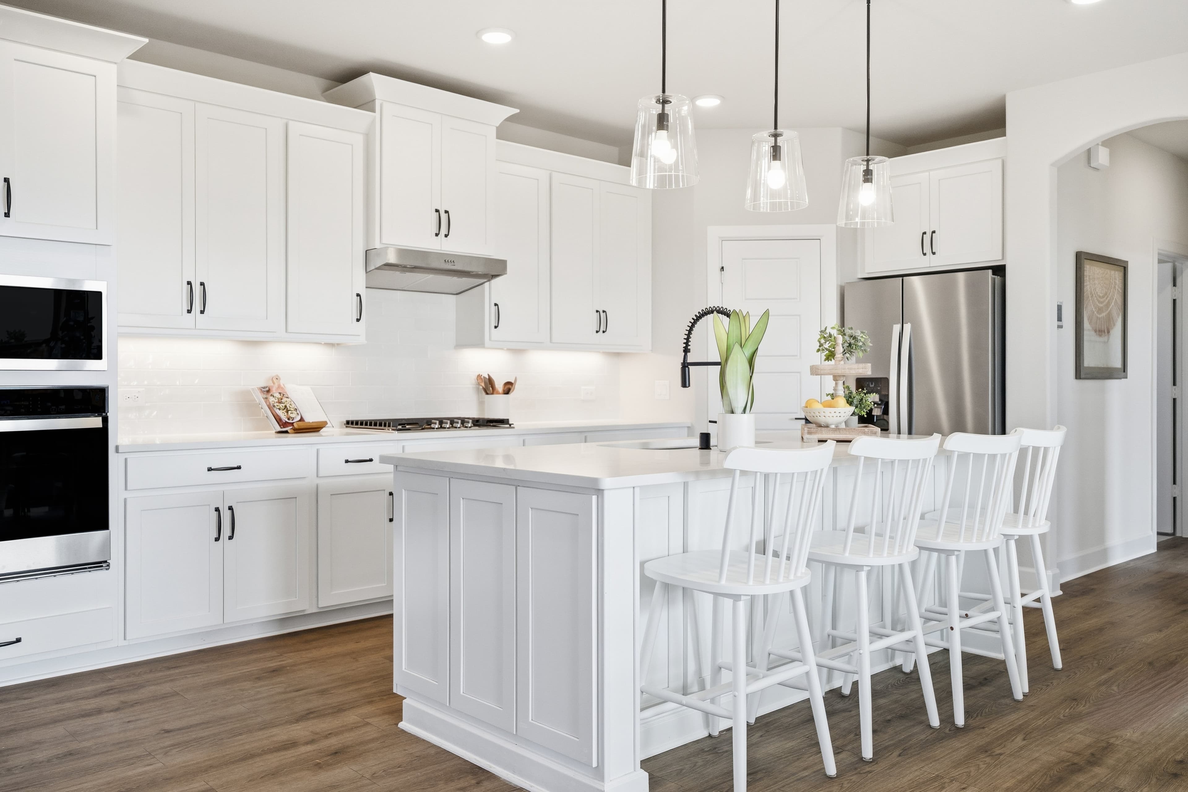 open kitchen with white cabinetry