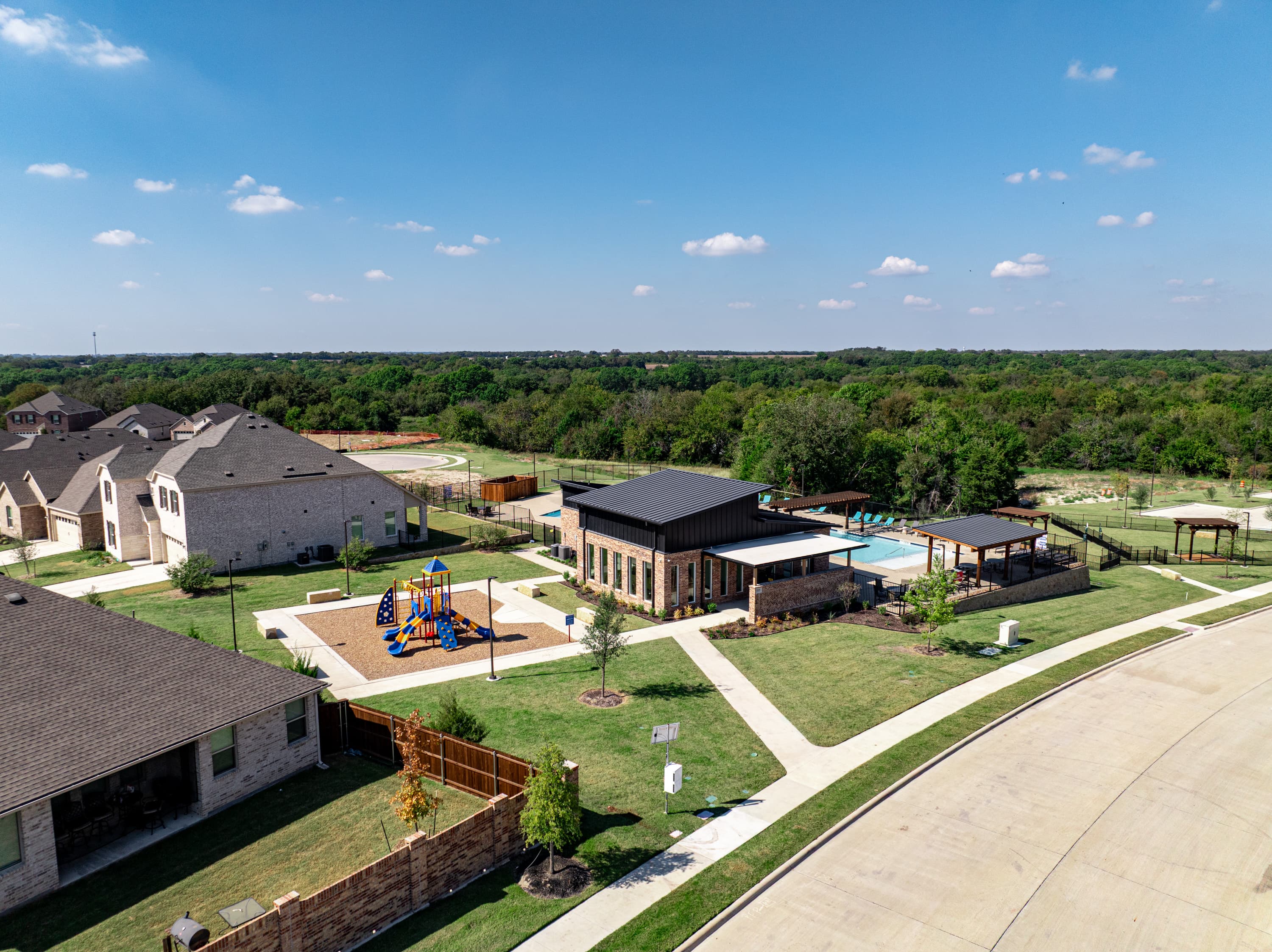view of amenity center and playground