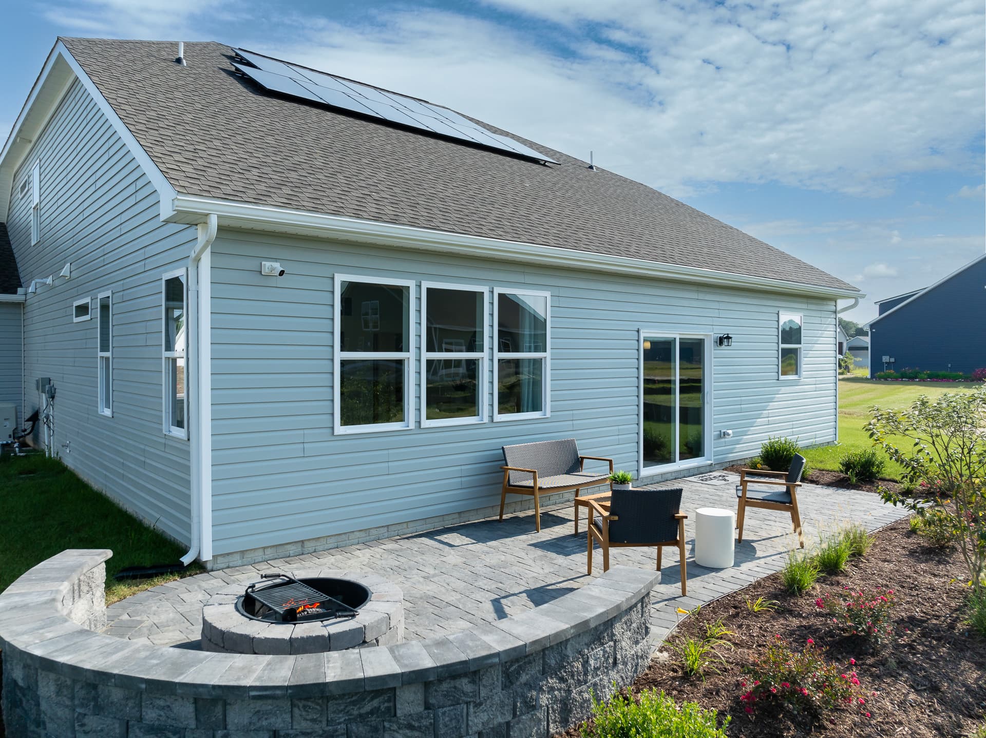 rear exterior with solar panels on the roof