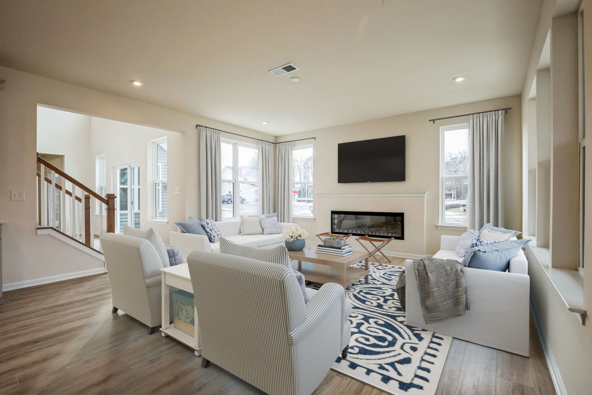 great room with seating and a fireplace