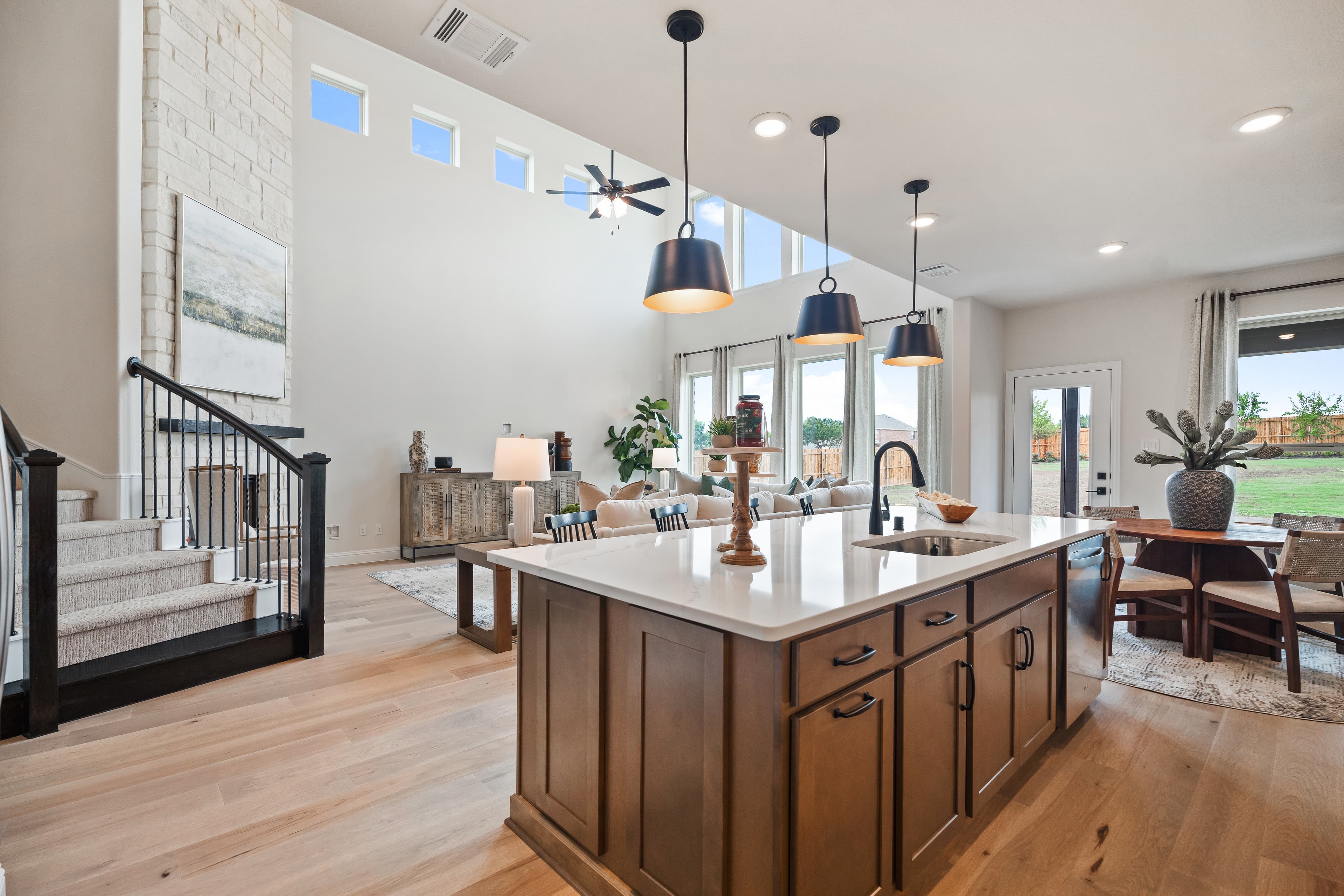 open great room and kitchen with wood floors