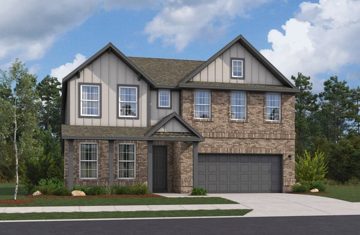 exterior with grass, trees & a 2-car garage