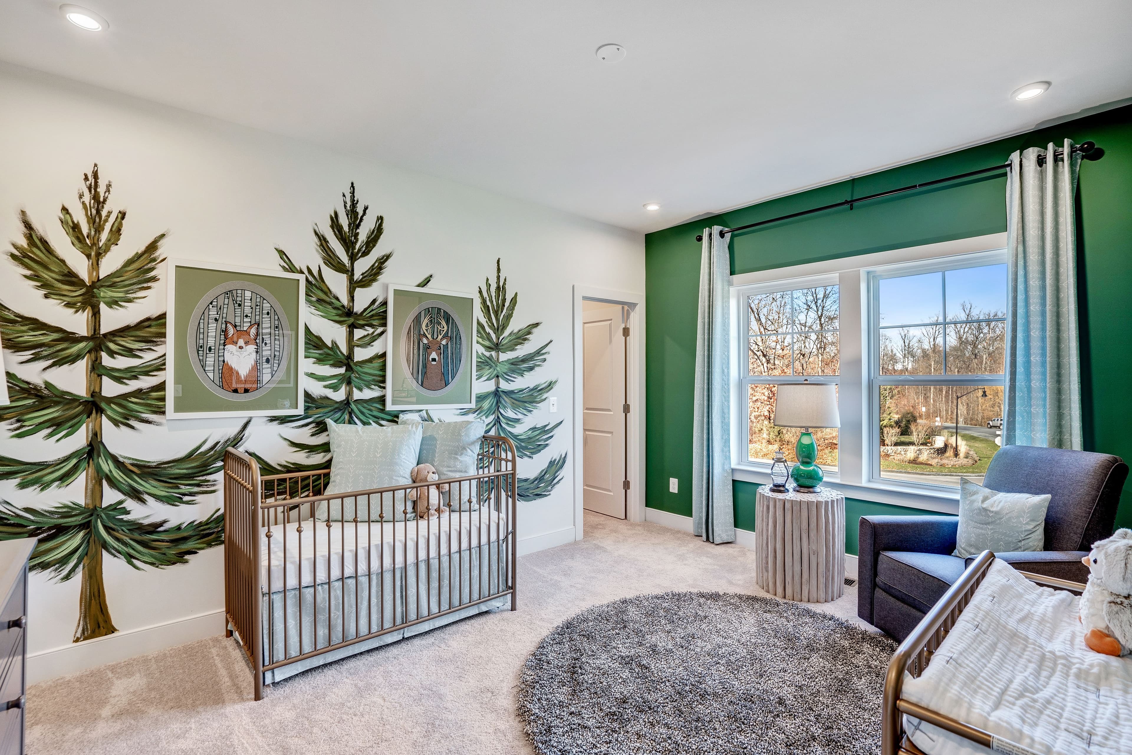 secondary bedroom with a crib and changing table