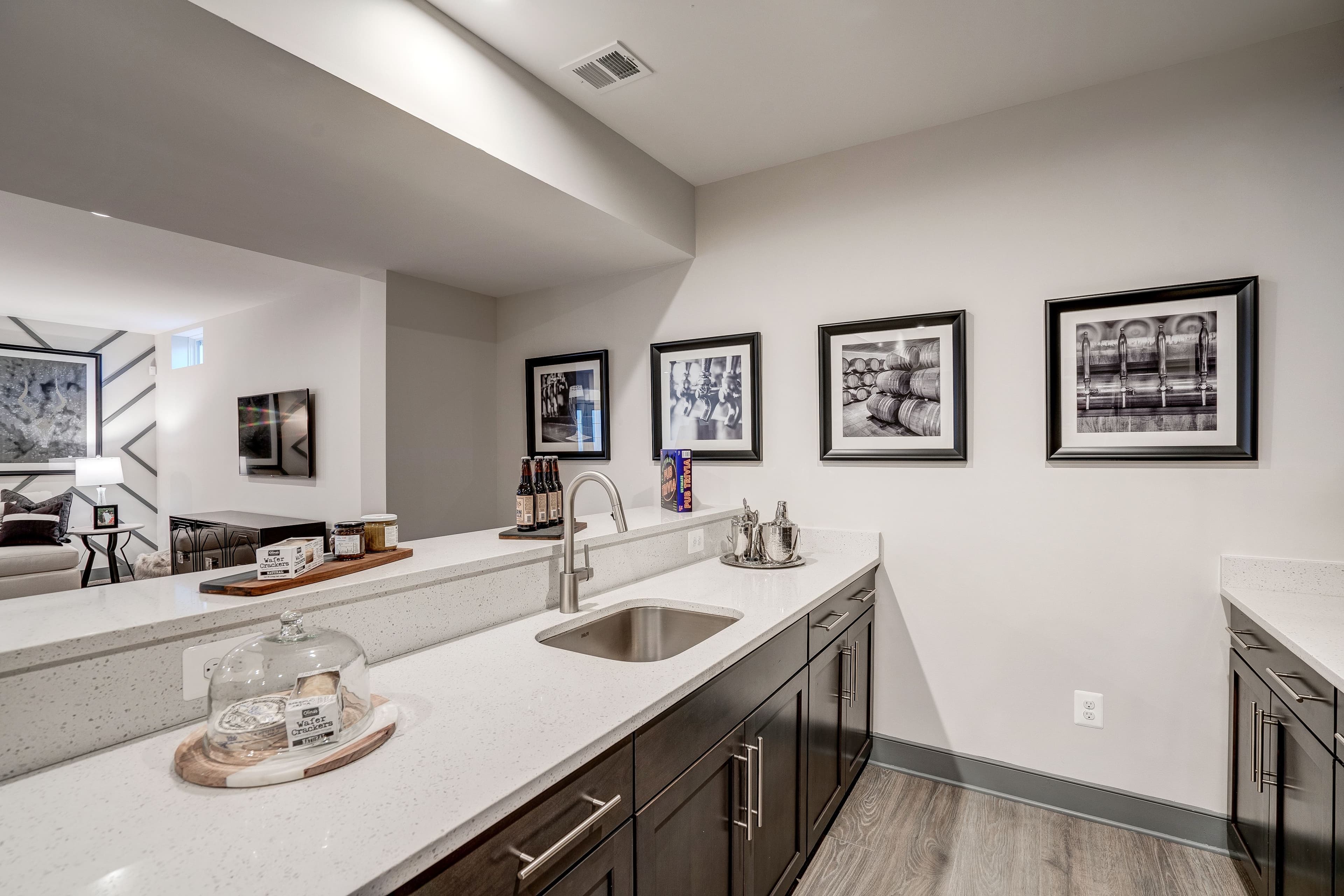 wet bar with a sink and cabinets