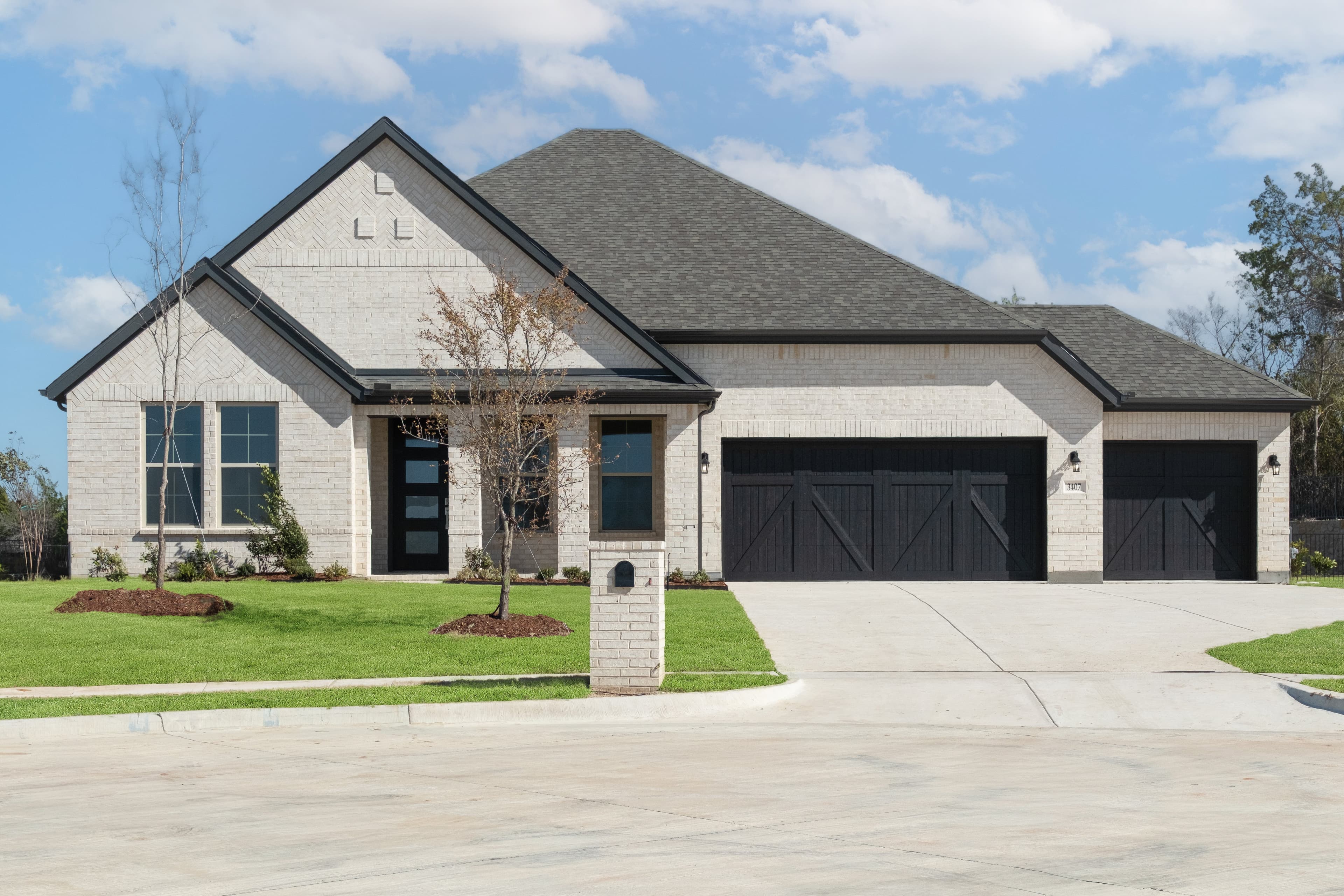 exterior of home with front porch and white brick