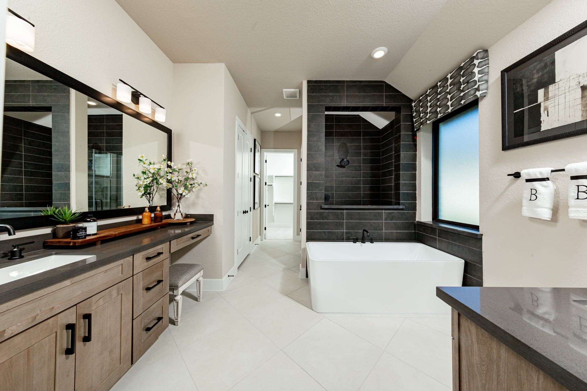 primary bathroom with large soaking tub and walk-in shower