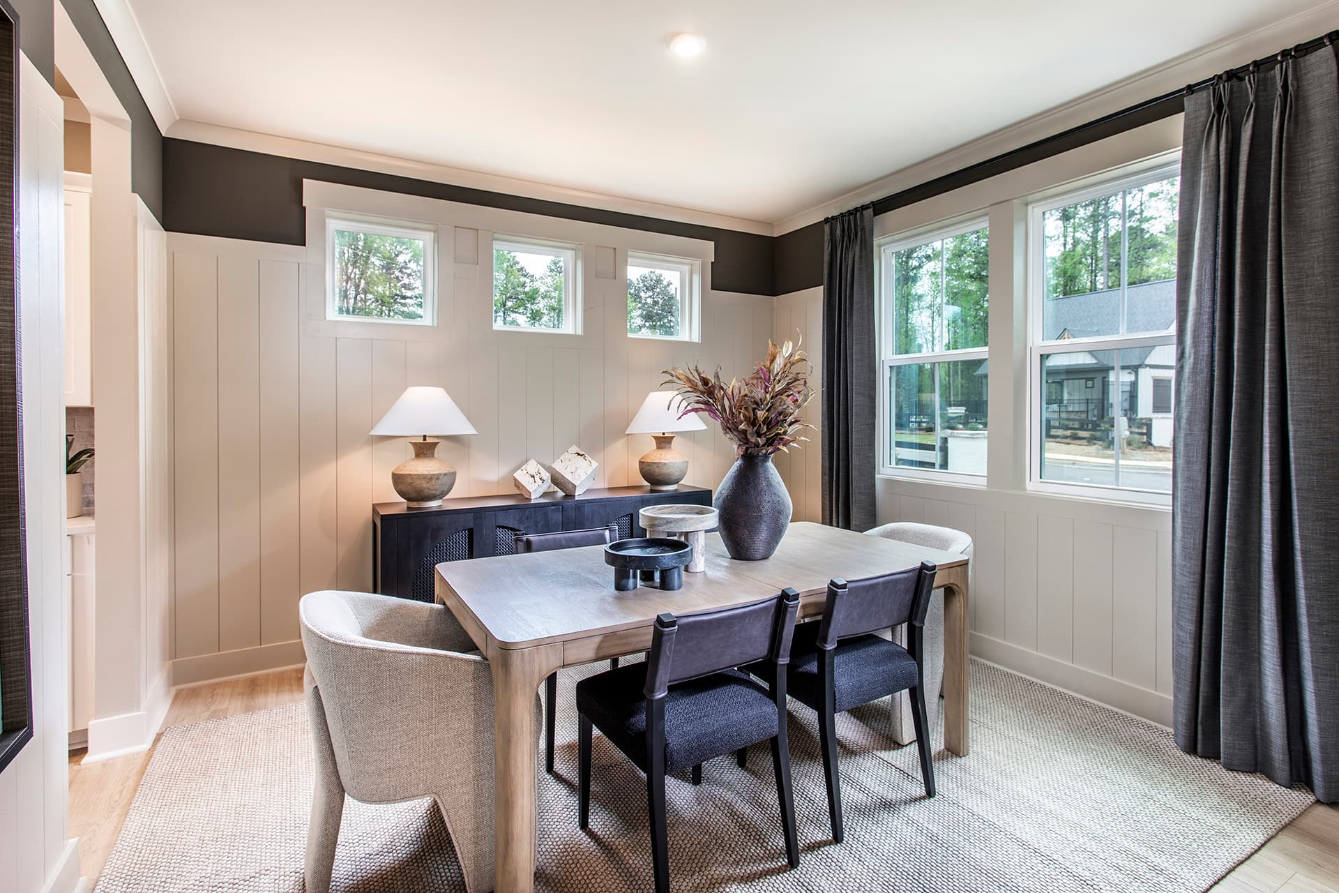 dining room with hard surface flooring and windows