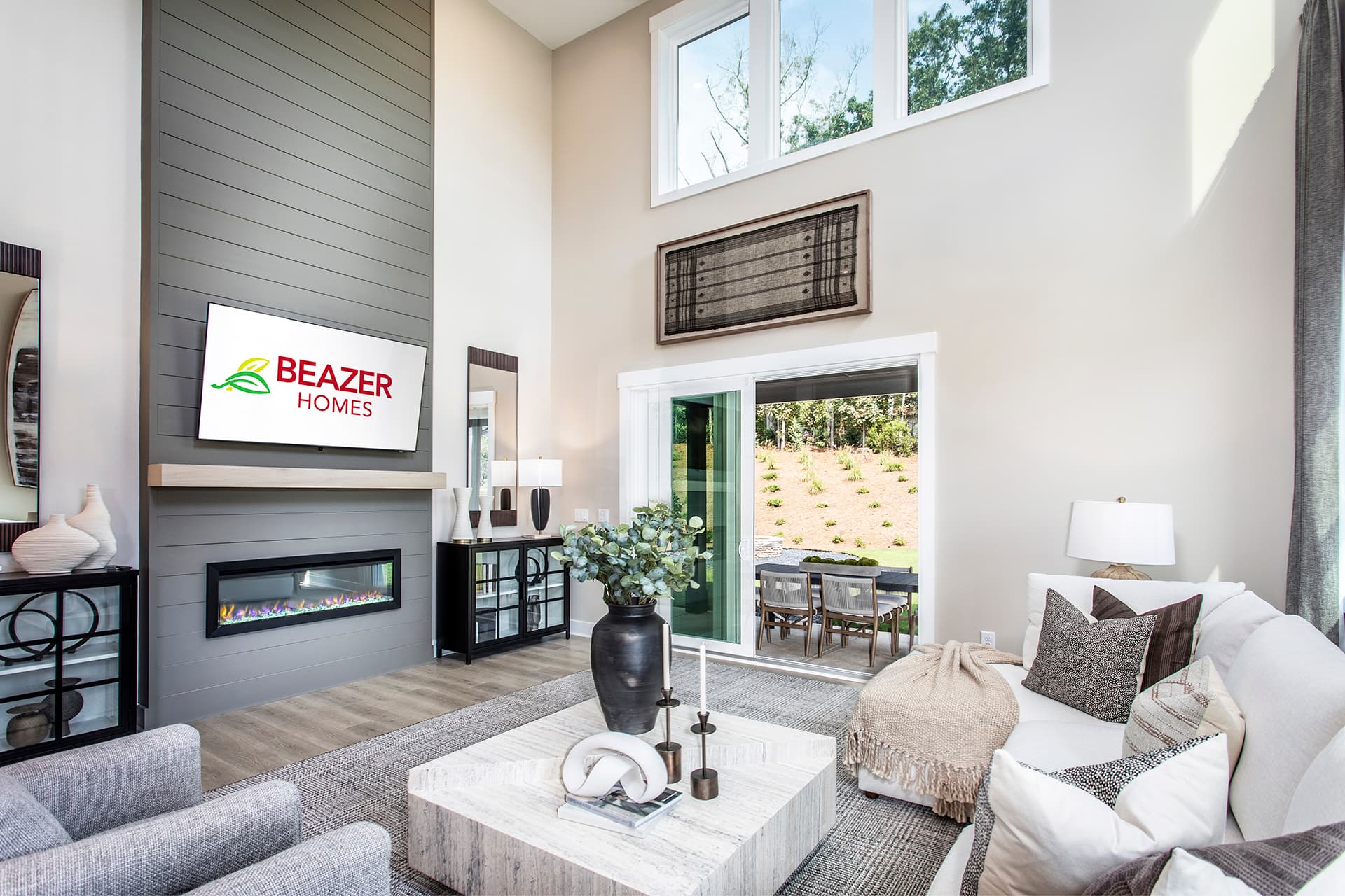 great room with electric fireplace & plank floors
