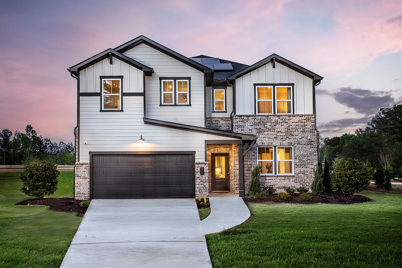 front of 2-story home with dark accents and light siding