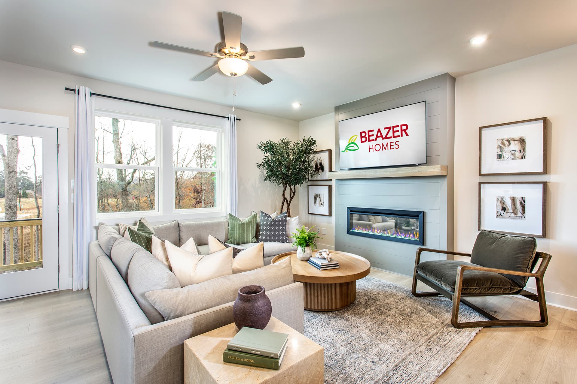 great room with electric fireplace and hard-surface flooring