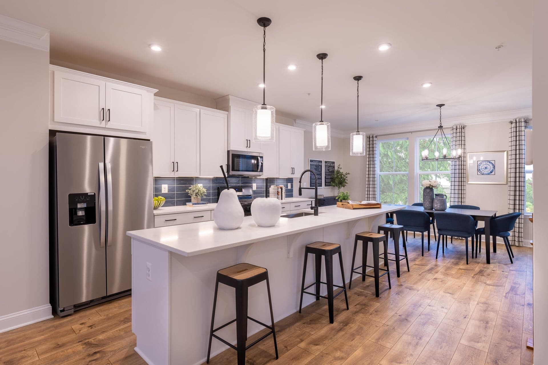 kitchen with hardwood floors and pendant lighting