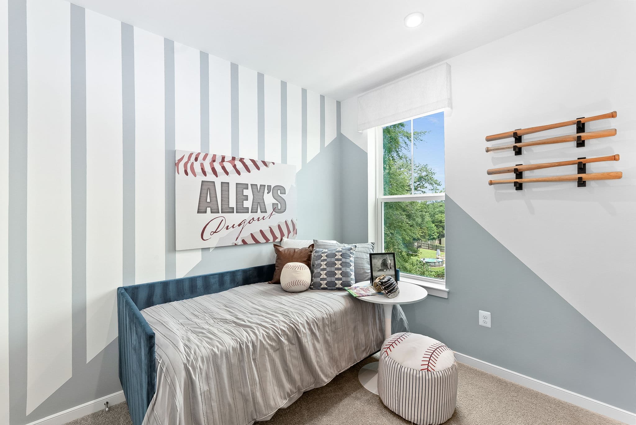 twin bed with night stand and window next to bed
