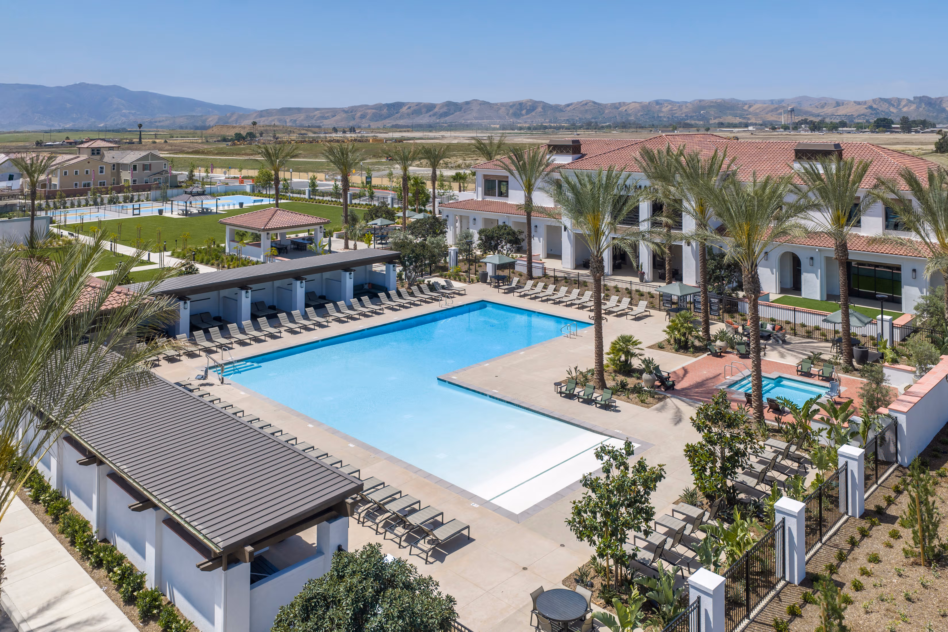 pool with spa and lounge chairs