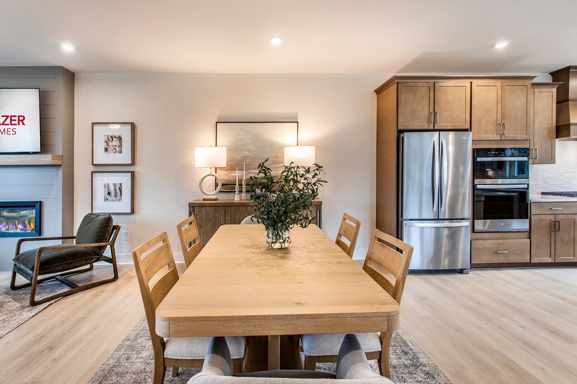 dining room with wood table between kitchen and great room